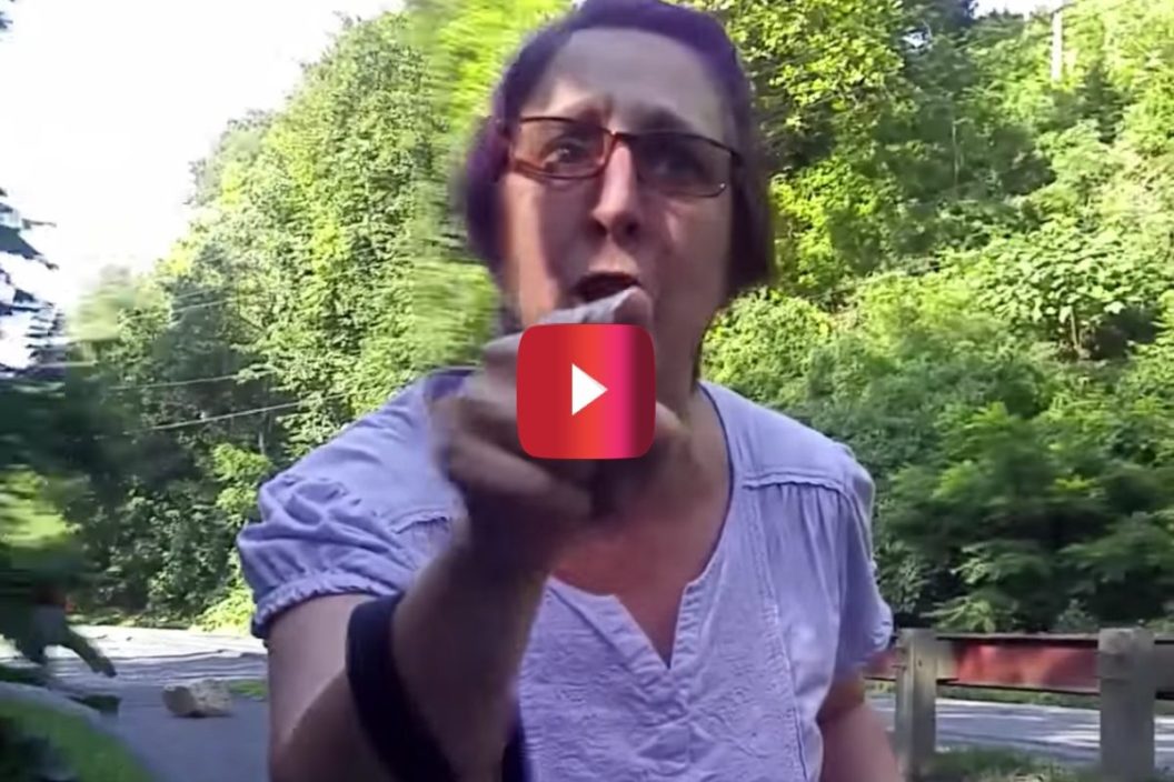 angry woman yells at e-bike rider