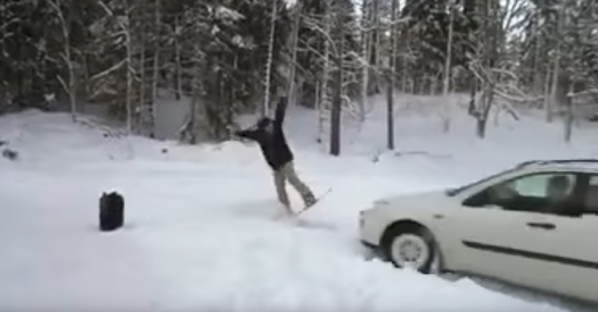 Snowboarder Tries To Flip Over Oncoming Car