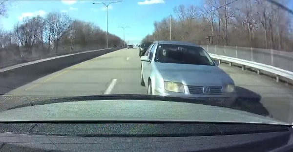 This Mercedes driver thinks he is totally innocent as he watches this Jetta crash behind him