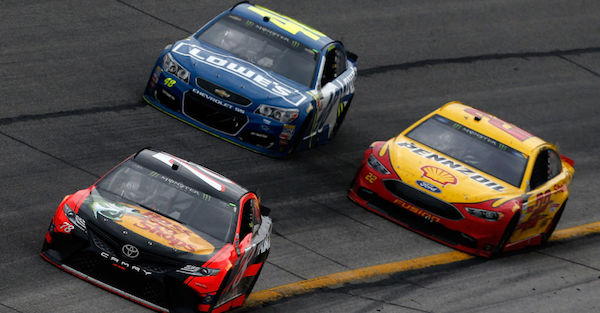 NASCAR officials confiscate a part straight off a car after the race in New Hampshire