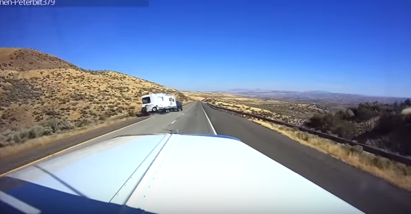 Watch this speeding driver flip his truck and camper after losing control on the highway