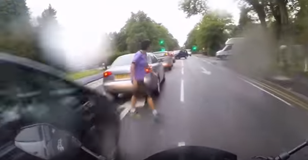 Watch this woman get crushed by a motorcycle when she forgets to look both ways