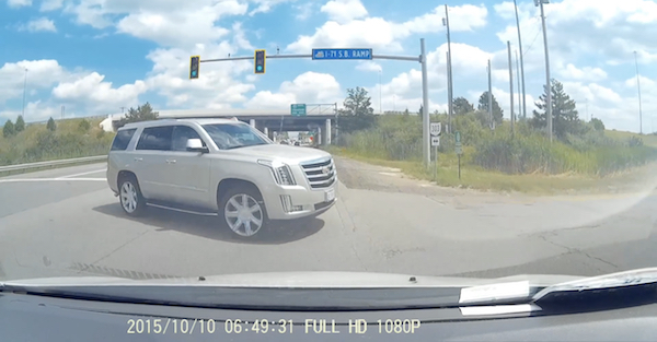 Watch as a distracted driver pulls a Cadillac into traffic and gets t-boned