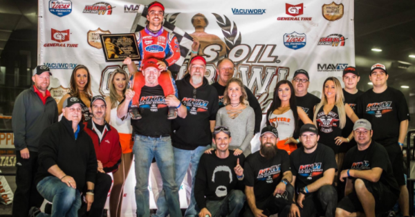 In his first action following a vicious wreck, former NASCAR driver wins to get a spot in Chili Bowl A-Main