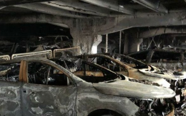 A massive parking garage fire took out a massive number of cars
