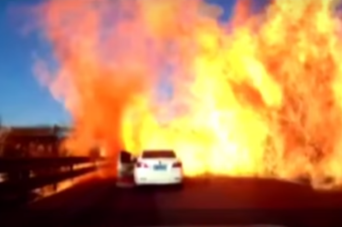 An overturned tanker turned a highway in a wall of hellish flames