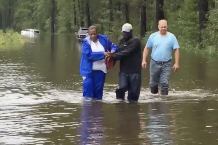 Reporter and Photojournalist Rescue Woman from Car Stuck in Hurricane Florence Floodwaters