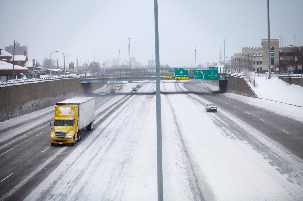 Motorist travel along Interstate-75 through several inches of snow as the area deals with record breaking freezing weather January 6, 2014 in Detroit, Michigan