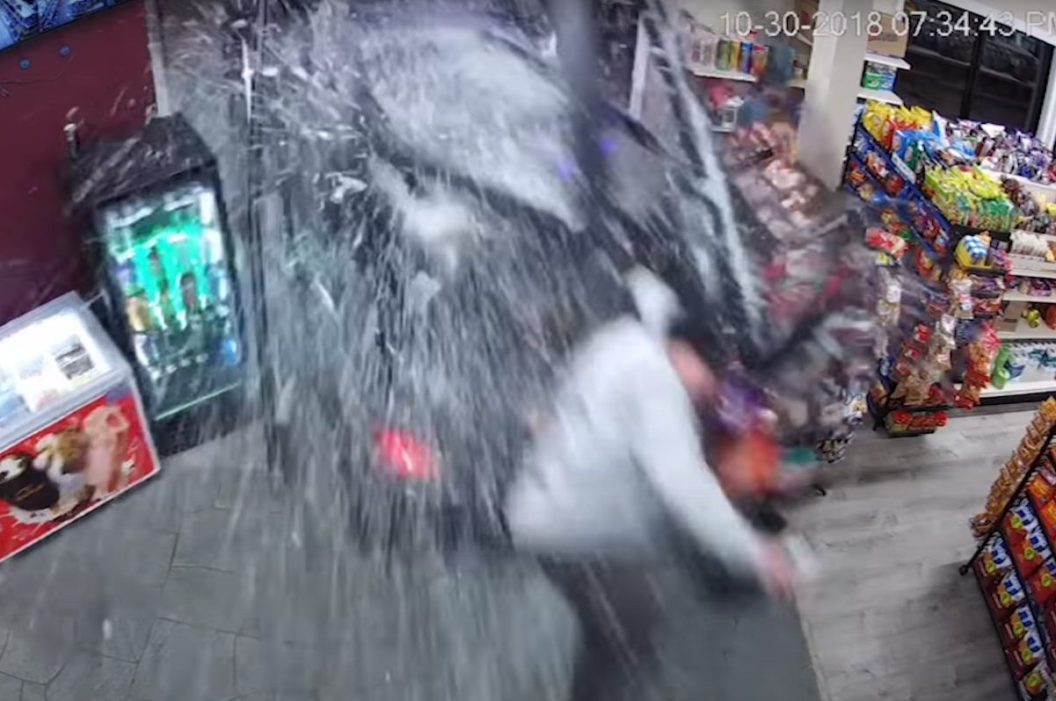woman crashes through liquor store