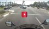 biker gets clipped by car