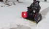 veteran plows snow with wheelchair