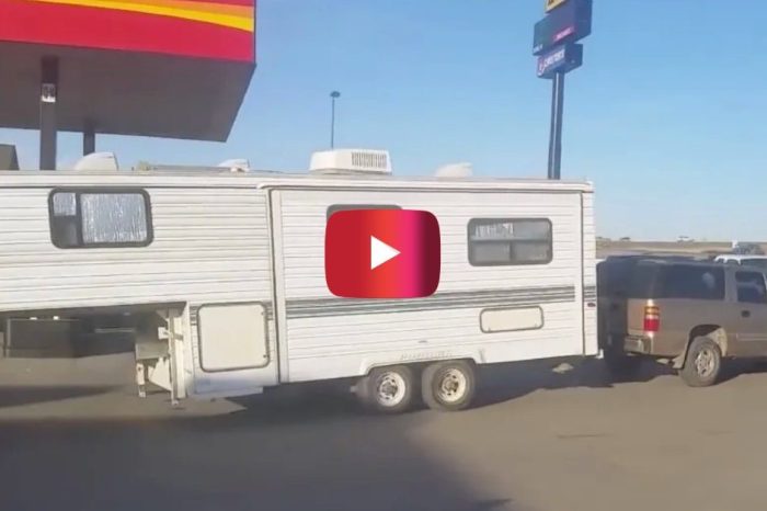 Driver Pulls 5th Wheel Camper Backwards With Bumper Hitch