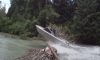 jet boat jumps over log