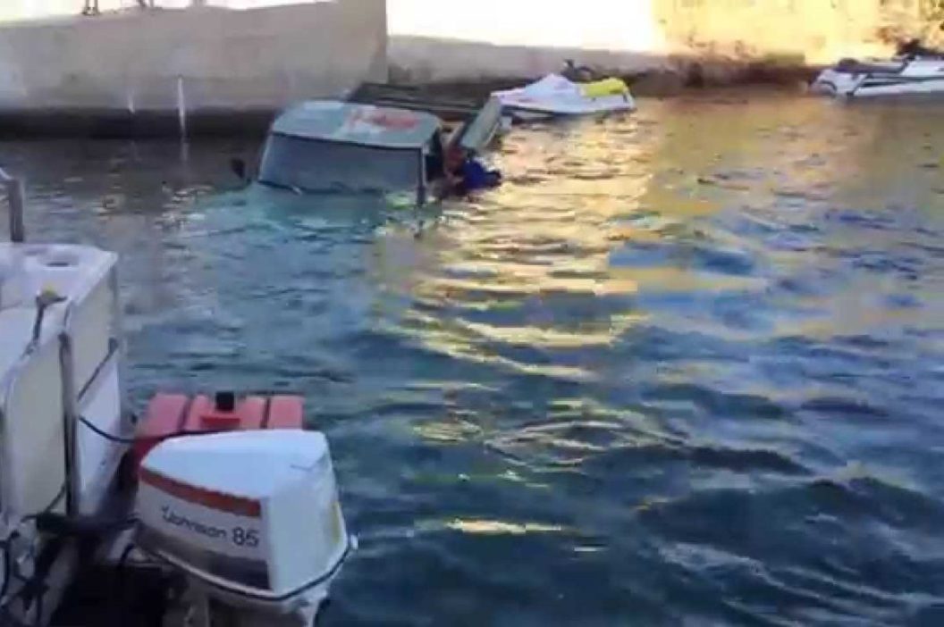 truck sinks into water