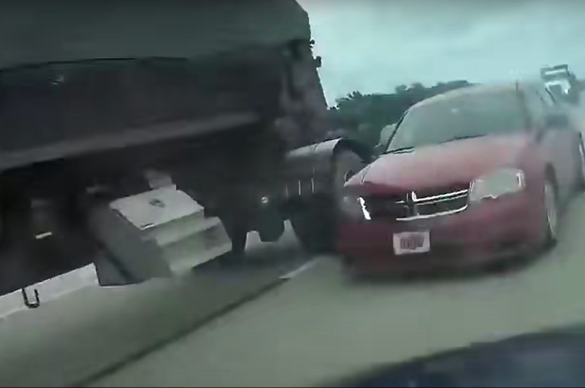car spins out after failing to yield to semi
