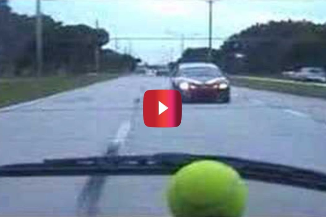 driver unleashes tennis ball on tailing car