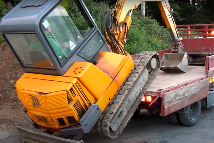 Mini Excavator Operator Gets Into Truck Without a Ramp