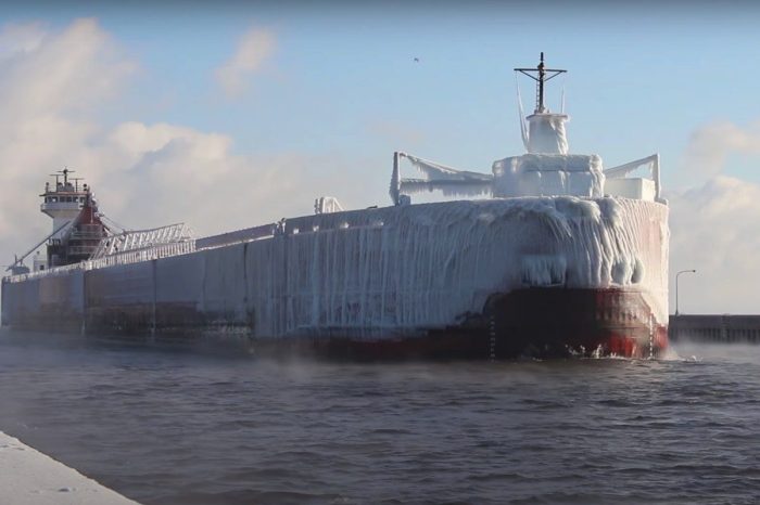 Massive Ice-Coated “Ghost Ship” Pulling Into Canal Is an Incredible Sight