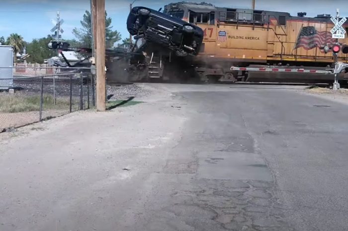 Train Smashes Through Car Carrier at High Speed, Sends Prius Flying