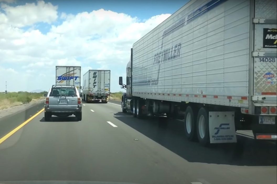 trucker passes blocking semis