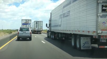 trucker passes blocking semis