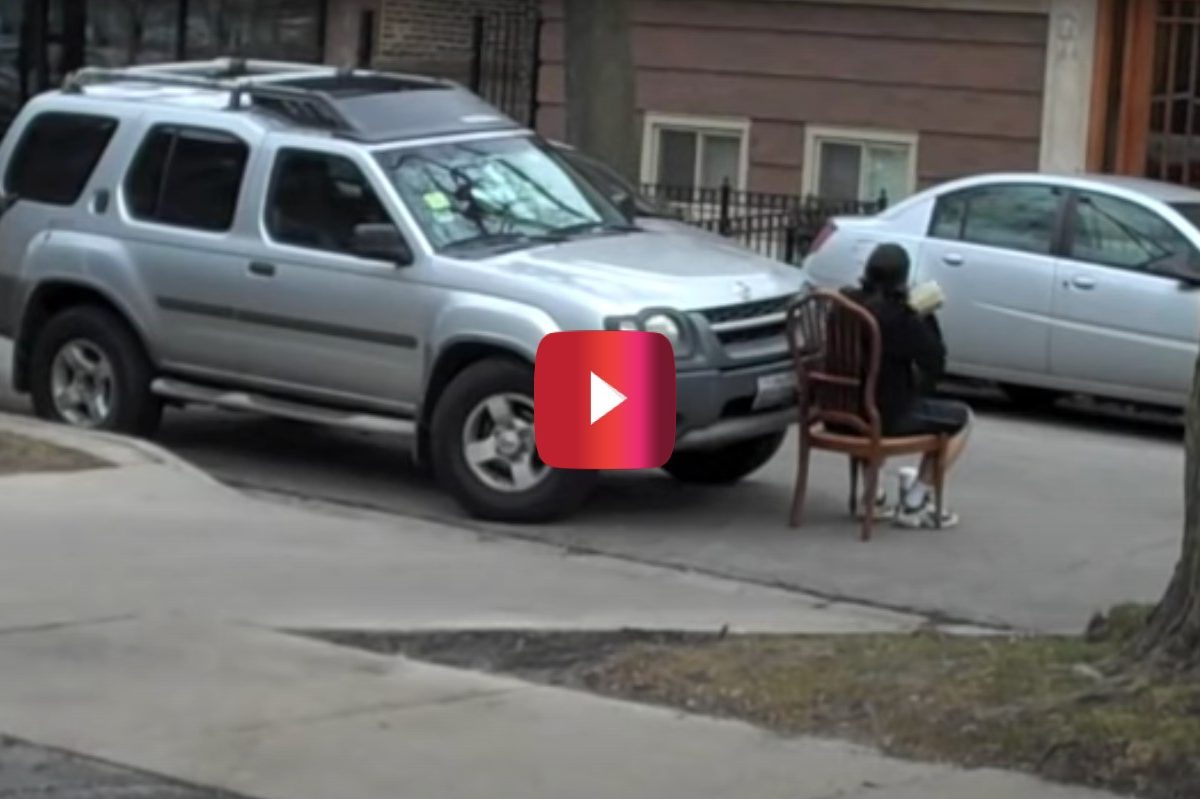 guy in chair blocking double parker