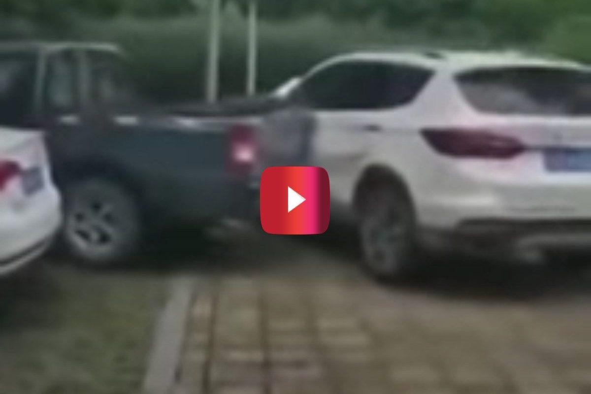 pickup truck driver hits illegally parked car