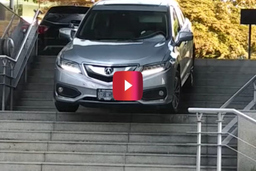 suv owner drives down stairs