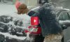 dad uses son to clear snow off car