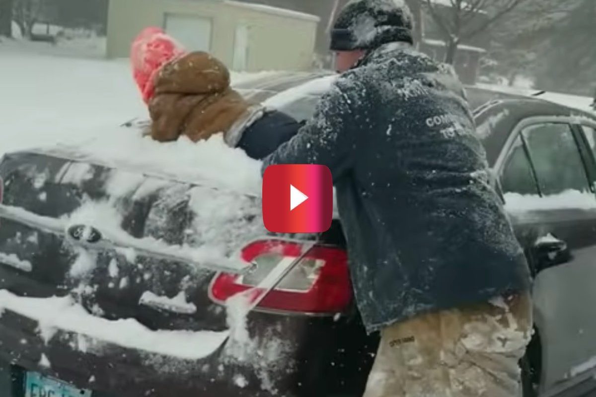 dad uses son to clear snow off car