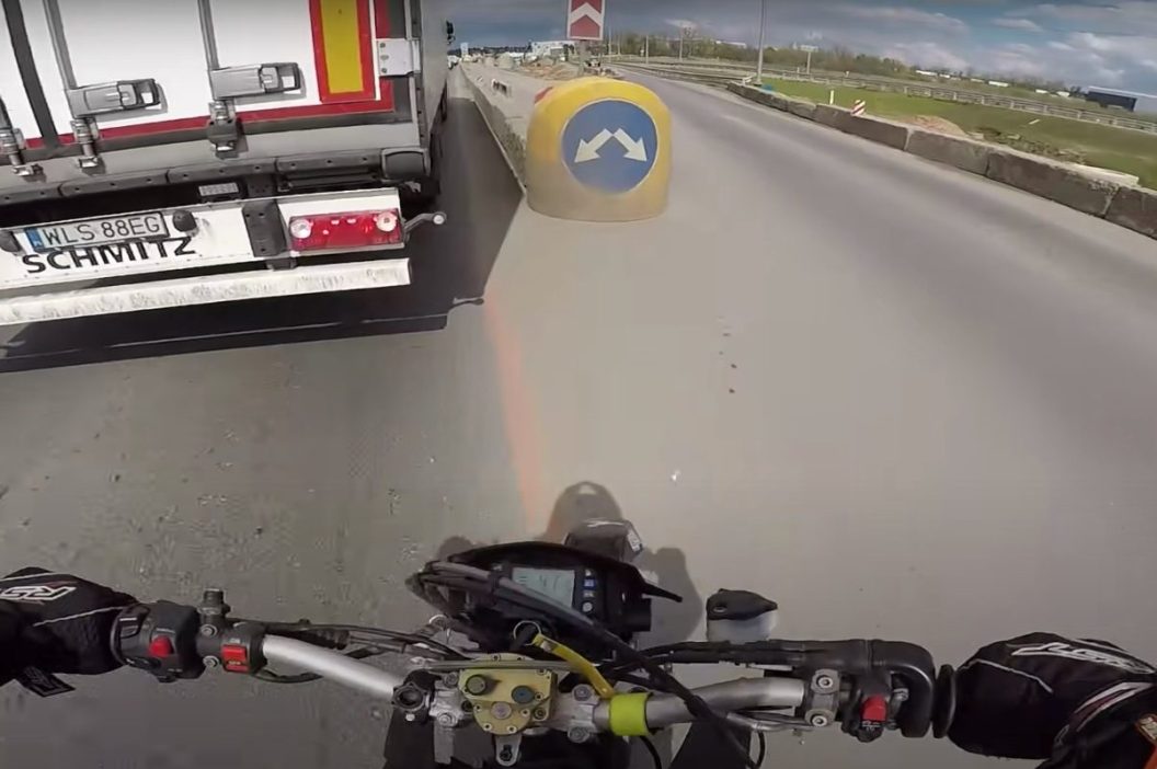 motorcycle crashes into barrier