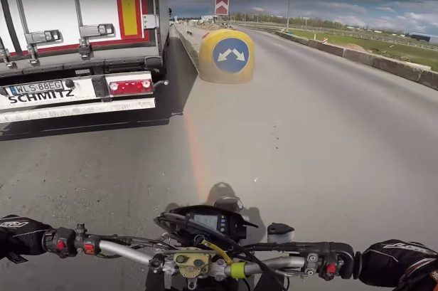 Motorcyclist Nails Surprise Barrier After Trying to Pass Semi