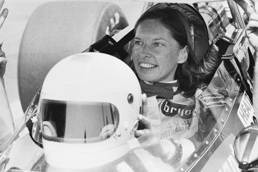 black and white photo of janet guthrie in race car