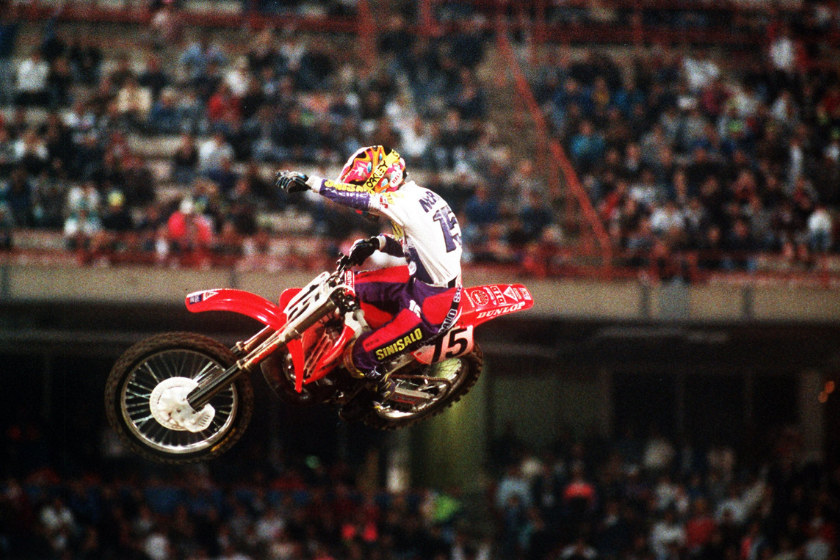 jeremy mcgrath in mid air during supercross event