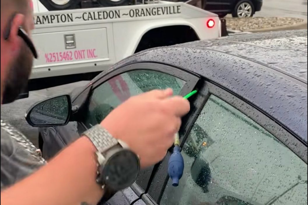 tow truck driver unlocks car without keys