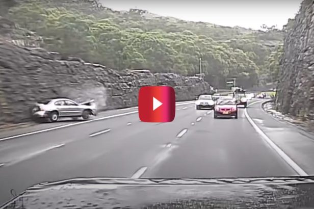 Ford Falcon Spins Out and Crashes on Slick Highway