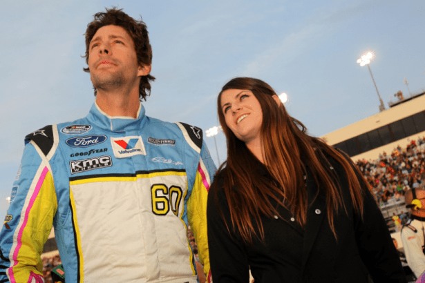 Travis Pastrana stands with his wife Lyn-Z before the start of the NASCAR Nationwide Series ToyotaCare 250 at Richmond International Raceway on April 26, 2013 in Richmond, Virginia