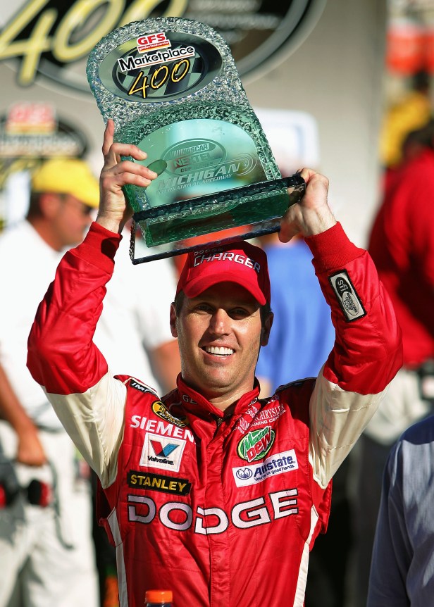  Jeremy Mayfield holds trophy after after winning the GFS Marketplace 400 Nextel Cup Series Race on August 21, 2005