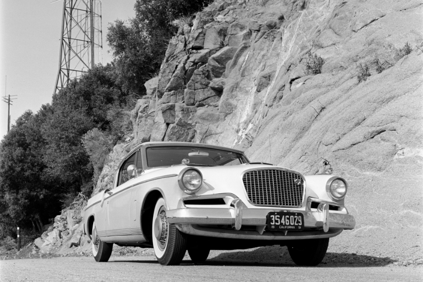 1956 Studebaker Golden Hawk V8 in the Angeles National Forest during Hot Rod magazine test. Test crew pauses on the way to Mount Wilson observatory. Low front 3/4 view