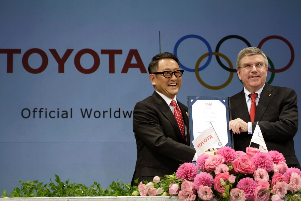 Toyota President and CEO Akio Toyoda and IOC President Thomas Bac