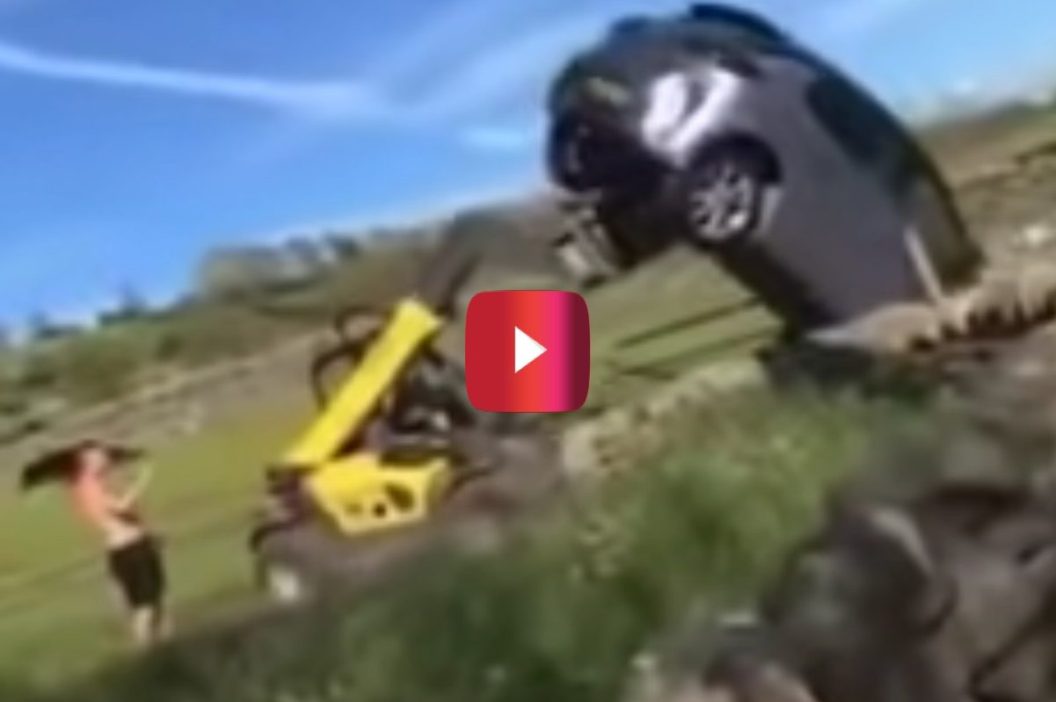 farmer uses tractor to flip car