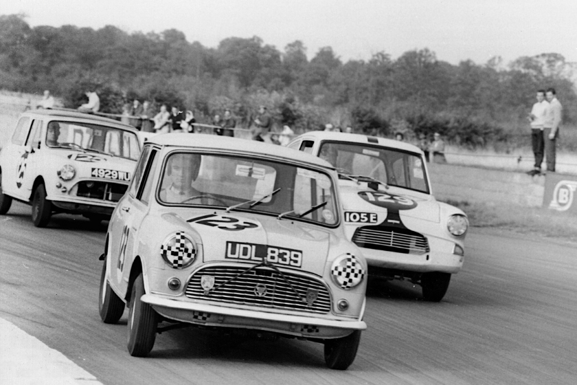 black and white photo of minis racing