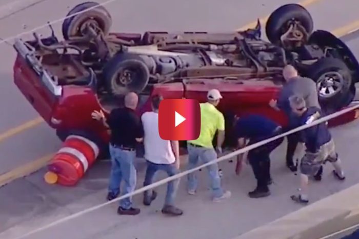 Good Samaritans Help Flip Overturned Truck on Busy Highway to Rescue Driver