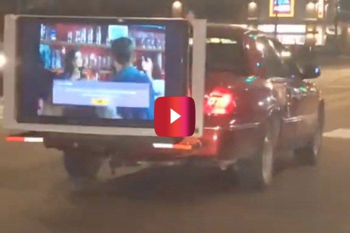 One Driver Turned His Car Into a Mobile Movie Theater, and Talk About an Accident Waiting to Happen