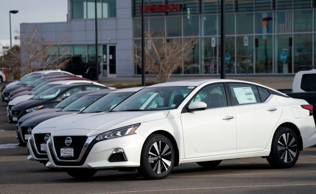 A long row of unsold 2021 Altima sedans sits at a Nissan dealership Sunday, Dec. 27, 2020, in Highlands Ranch, Colo.