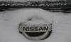 nissan logo covered in snow