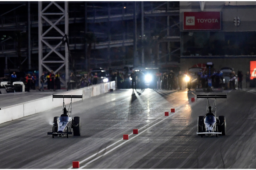Top Alcohol Dragster driver Jasmine Salinas (left) heads down track during qualifying at the the Dodge SRT NHRA Las Vegas Nationals at The Strip at Las Vegas Motor Speedway in Las Vegas, Nevada on Friday, Oct. 29, 2021
