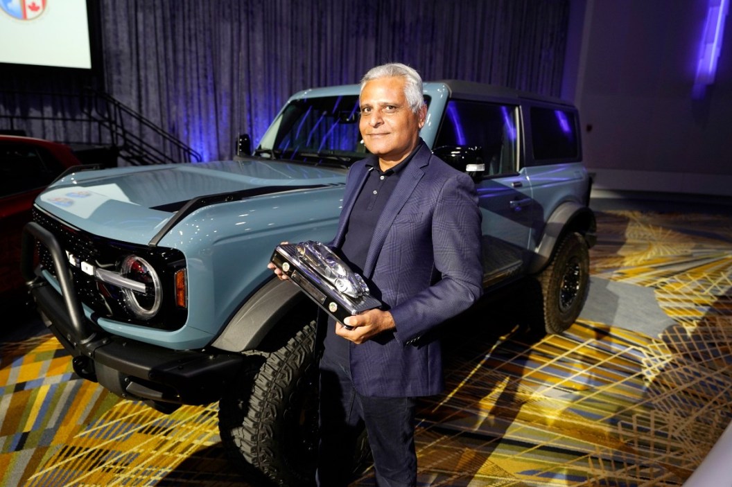 Kumar Galhotra, Ford President of the Americas and International markets group poses next to the Bronco off-road SUV, Tuesday, Jan. 11 2022 in Detroit