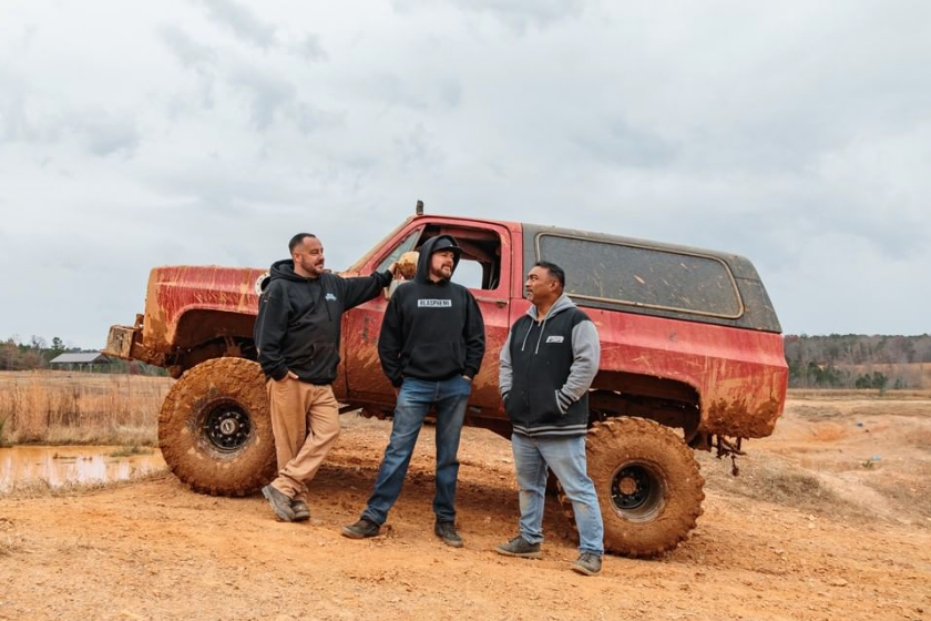 david newbern, mike finnegan, and mike cotten in front of muddy k5 blazer