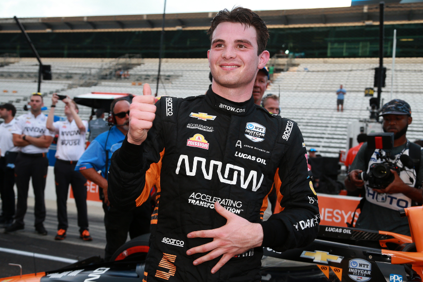 Pato O'Ward celebrates after winning the pole position during qualifying for the NTT IndyCar Series Big Machine Spiked Coolers Grand Prix at Indianapolis Motor Speedway on August 13, 2021 in Indianapolis, Indiana